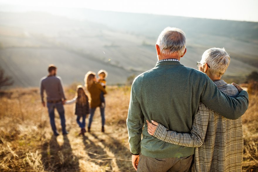 Multigenerational family gathered in a field
