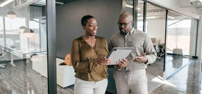 Two managers at work in a business office.