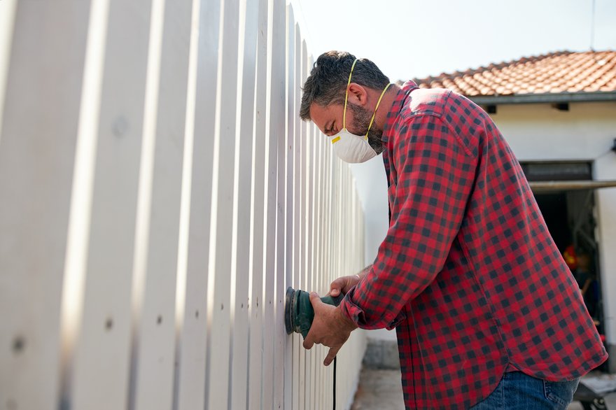 Person putting up fence.