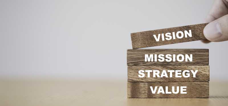 Words vision, mission, strategy, and value written on blocks.