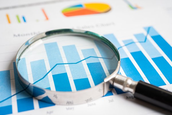 Magnifying glass on financial report