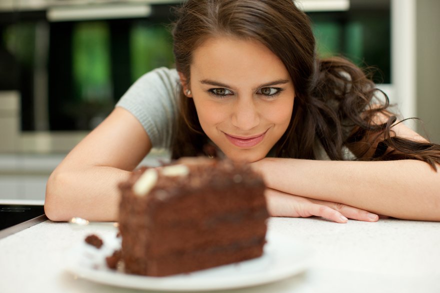 Woman looking at chocolate cake
