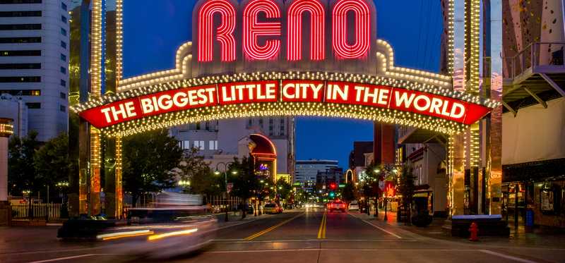 Sign over a city street in Reno says Reno, The Biggest Little City in the World.