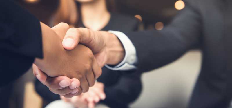People shaking hands.