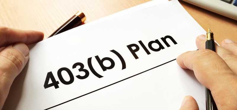 Paperwork for a 403(b) account is shown.