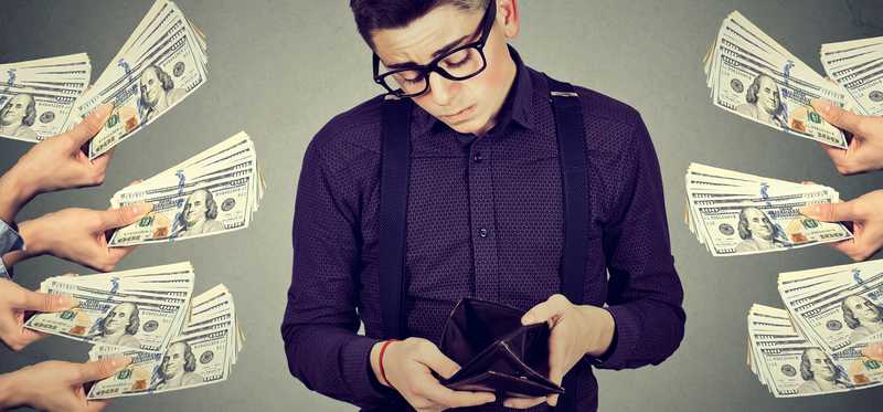 Man looking inside wallet while outstretched hands off cash.