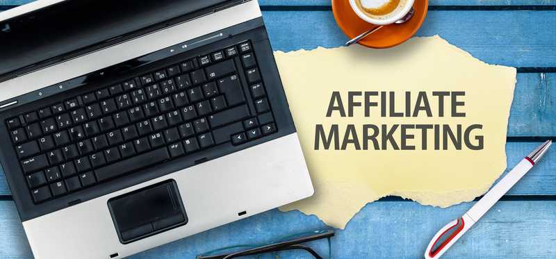 The words Affiliate Marketing next to a laptop.