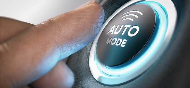 A finger pressing a button labeled Auto Mode.