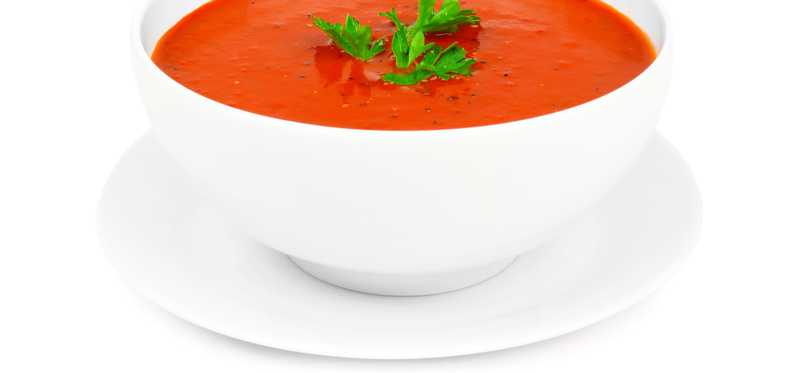 A bowl of tomato soup is shown.