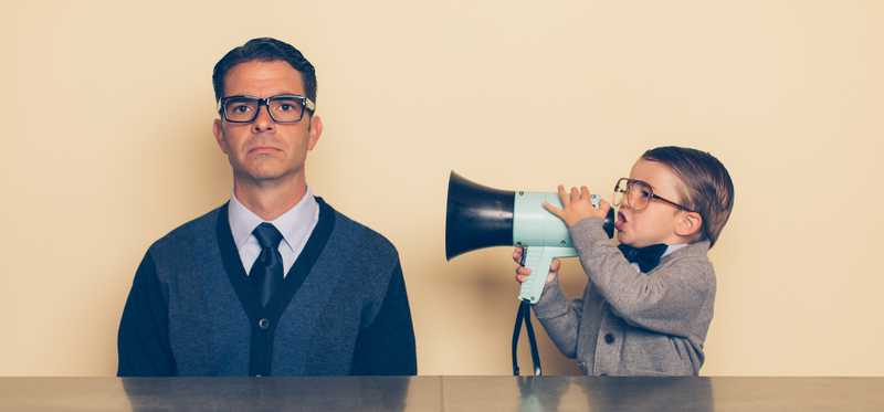 An adult is ignoring a child yelling through a megaphone.