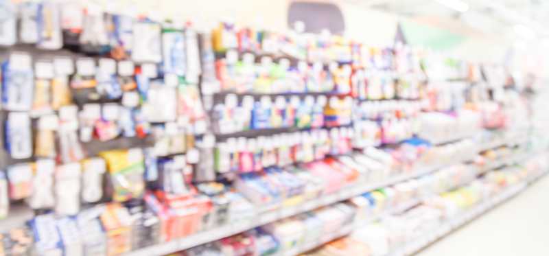 A blurry office supply store aisle.