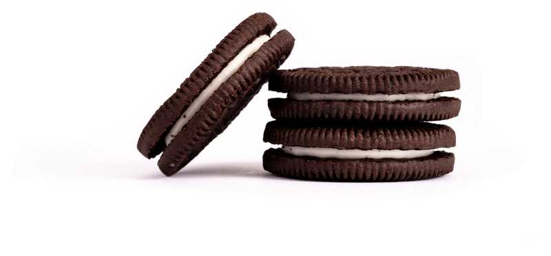 Several Oreo-like cookies are shown against a plain background.