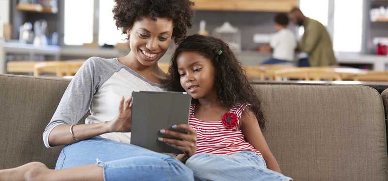 A mother is shown, talking with her daughter.