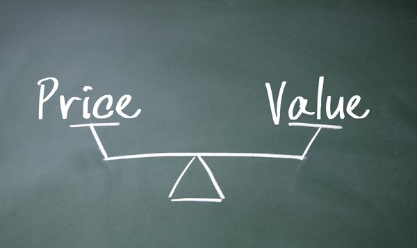 The words Value and Price at opposite ends of a balance, drawn on a blackboard.