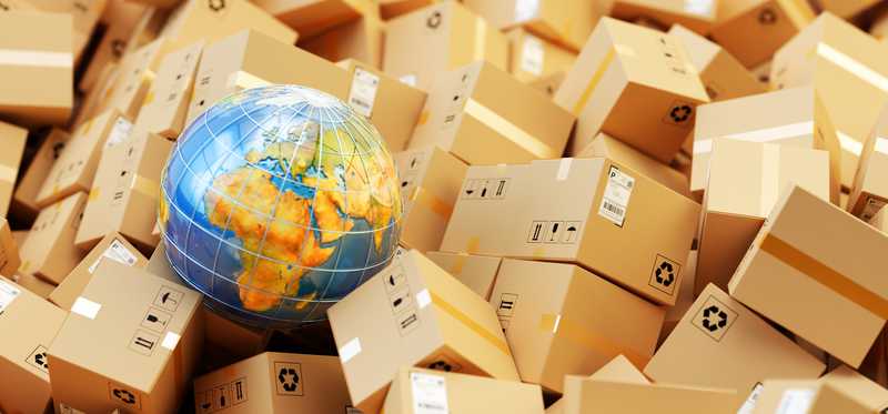A globe sits in a pile of packages.