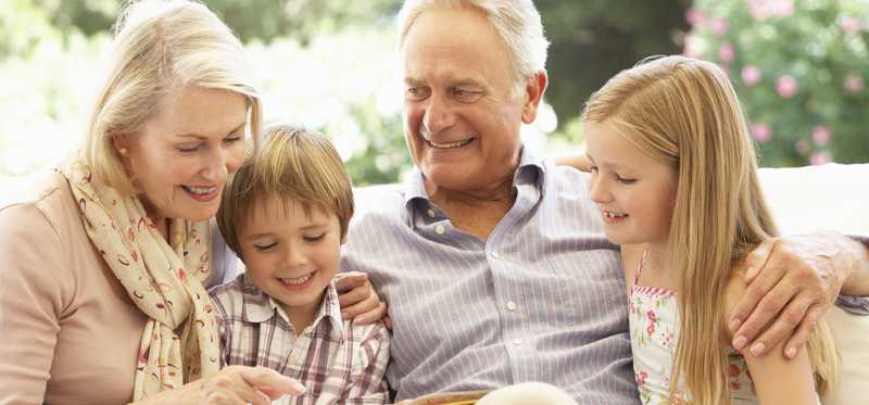 Older couple with young children.