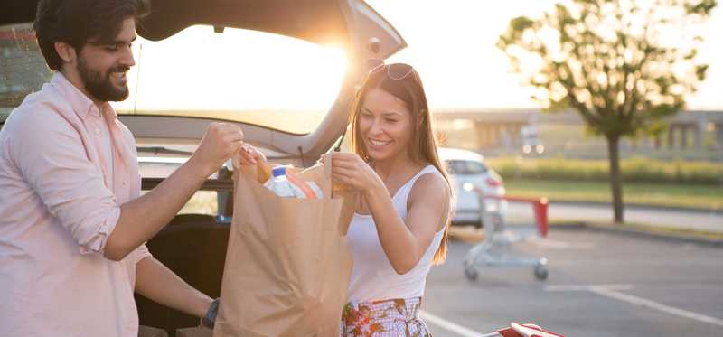 Two people share groceries.