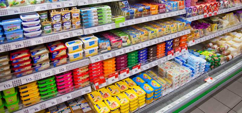 A grocery store aisle full of food.
