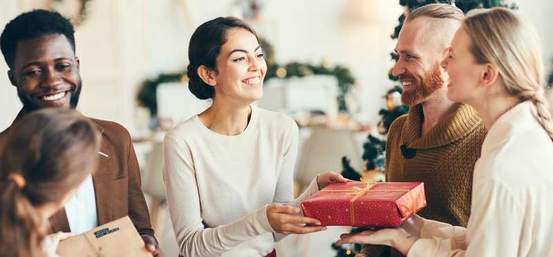 Group of friends exchanging gifts