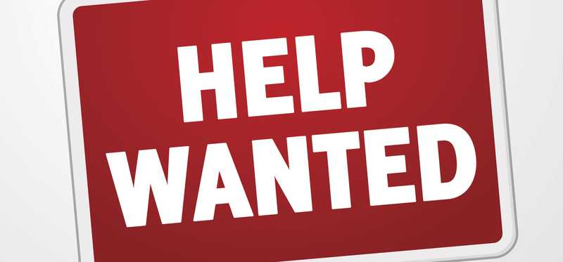 A red Help Wanted sign.