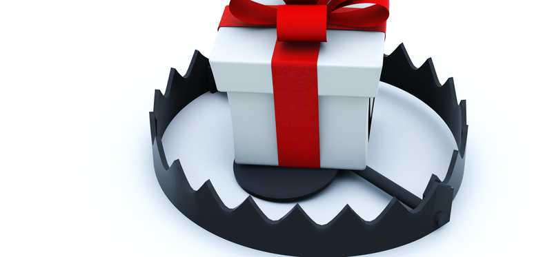 A present sits inside a bear trap.