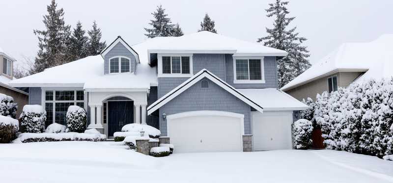 A house blanketed with snow.