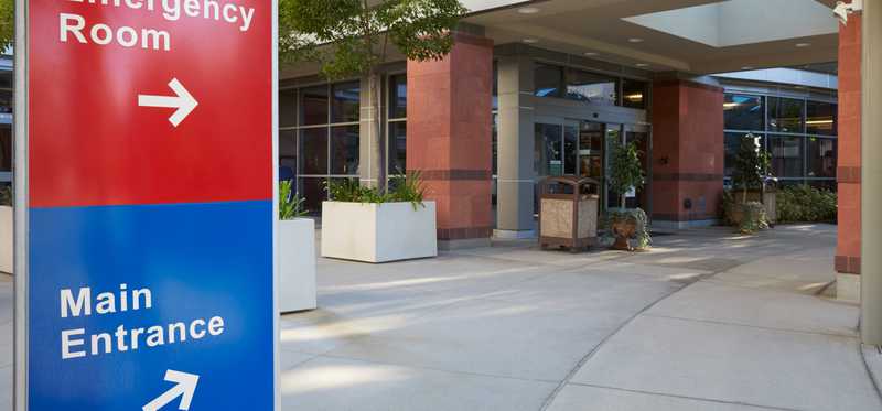 Signs for emergency room and hospital main entrance