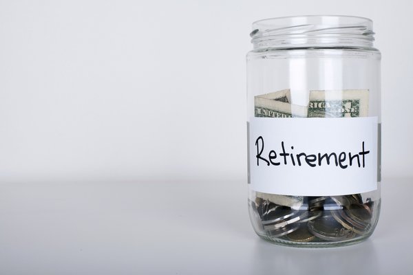 Jar labeled Retirement and half-filled with cash and coins