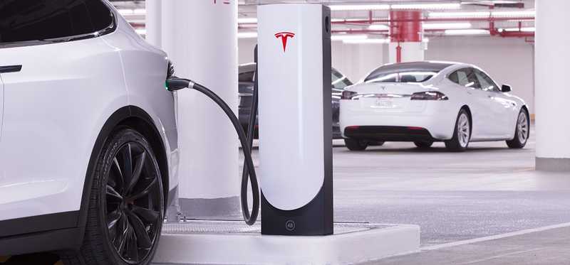 A Tesla car at a charging station.