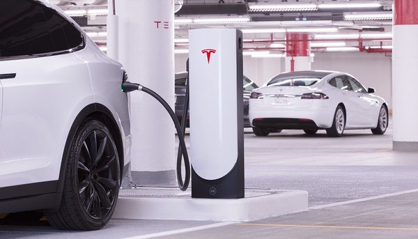 A Tesla car at a charging station.