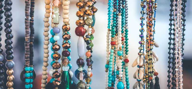Handmade necklaces on display.