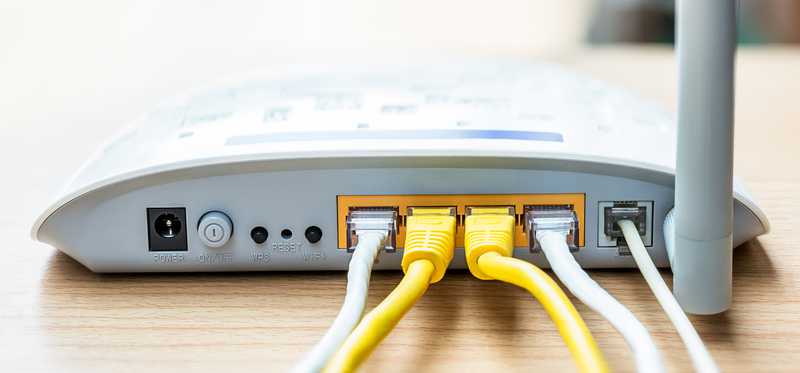 An internet modem with cables attached.