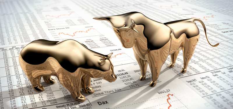 Metal figurines of a bear and bull.