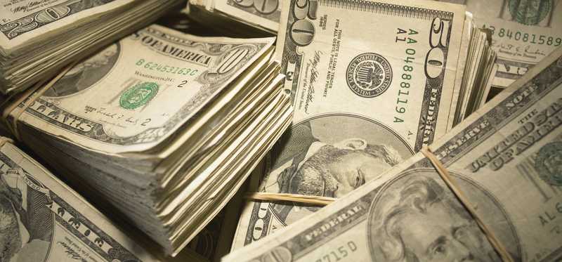 Large pile of assorted bills