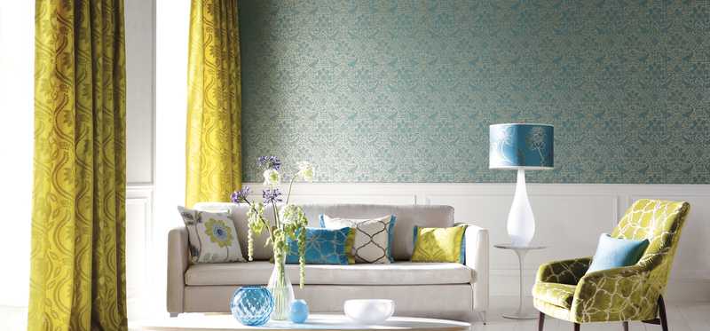 Living room with wallpapered walls.