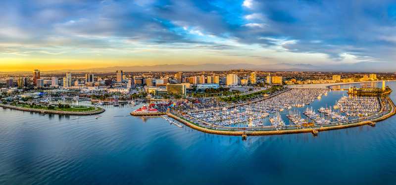 An ocean, marina, and skyline view of Long Beach, California.