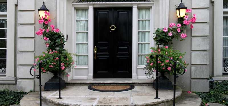 Luxury home with black front door.