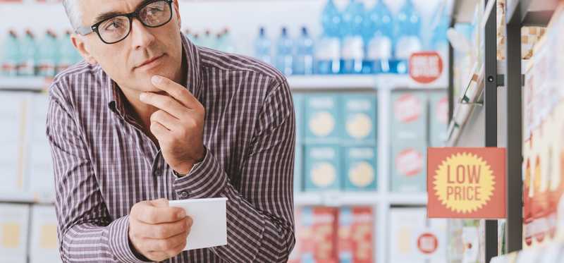 Person shopping with shopping list.