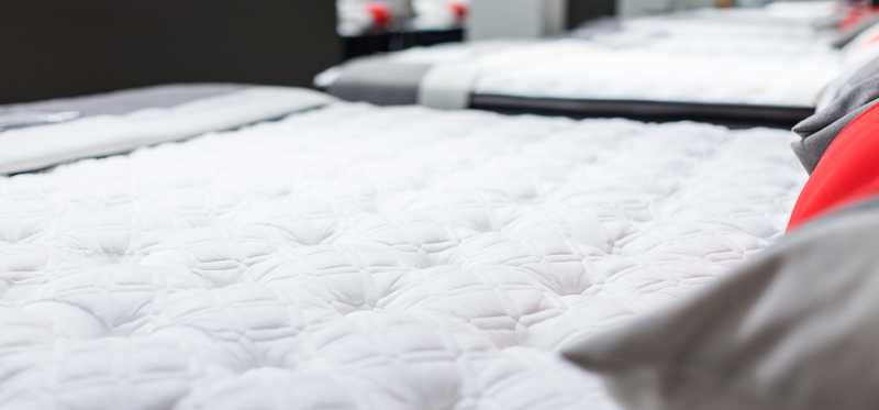 Mattresses are shown in a store.