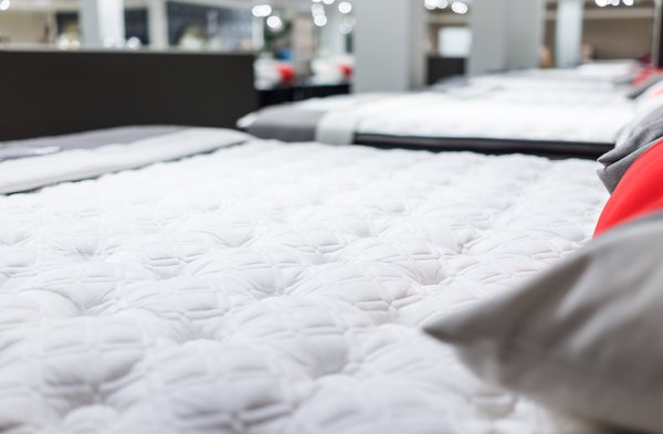 Mattresses are shown in a store.