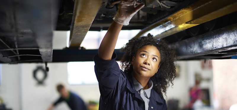 Mechanic working under a car.