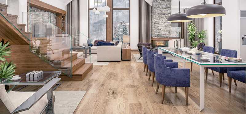 Modern living area with wood floors and stairs.