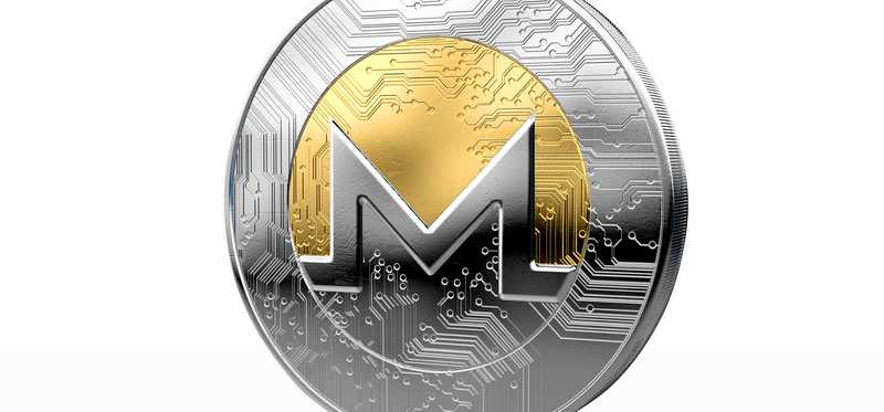 A silver and gold Monero coin