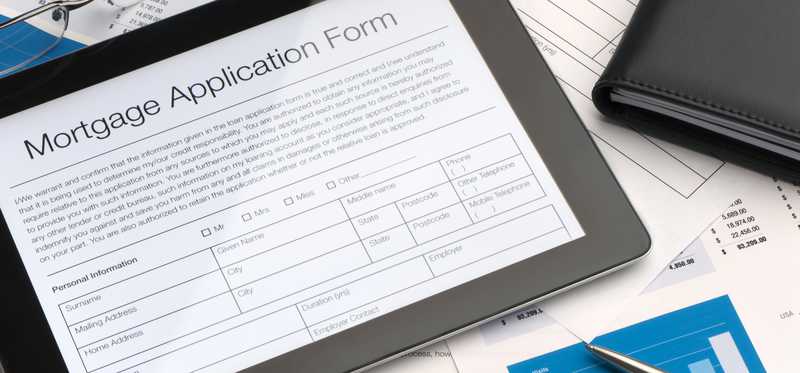A tablet showing a mortgage application.