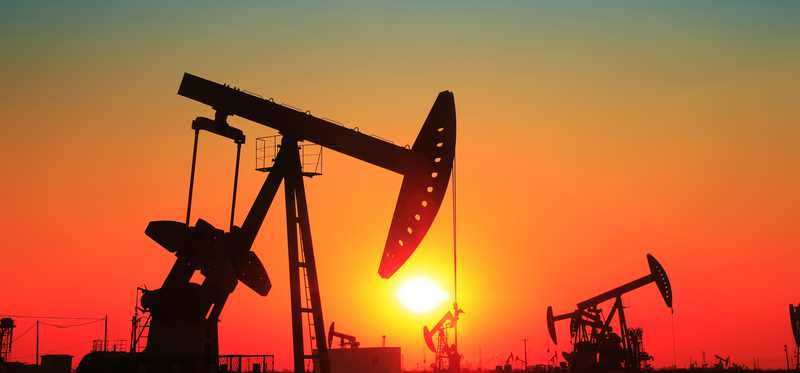 An oil rig at sunset.