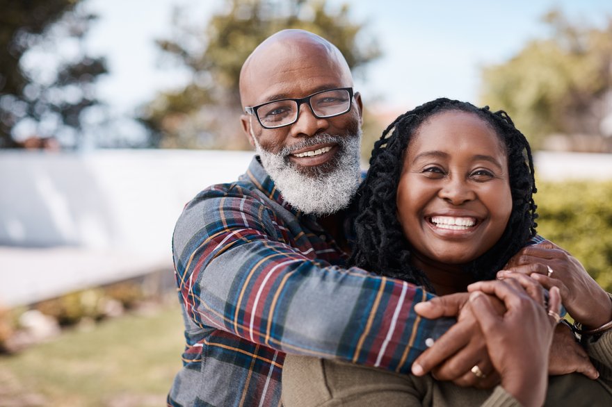 Older Couple Embracing and Smiling