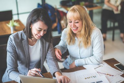 One woman giving another woman financial guidance