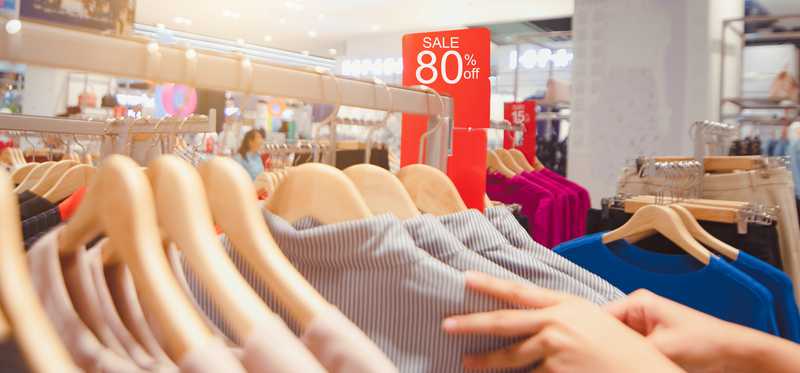 Racks of heavily discounted clothing.