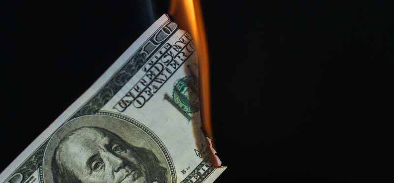 Hundred dollar bill burning