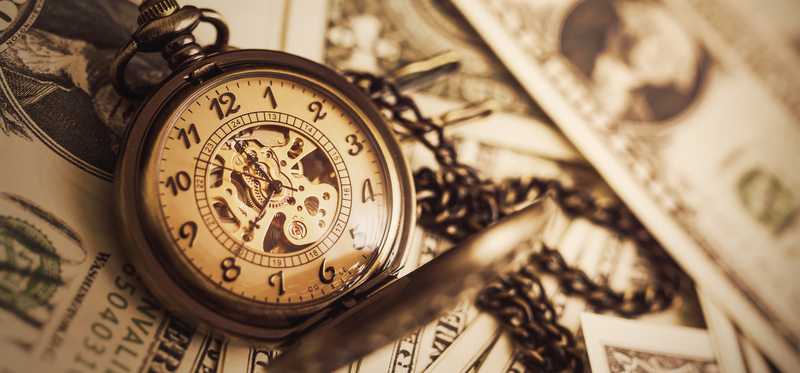 Pocket watch on dollar bills
